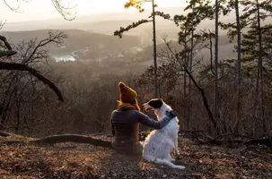 woman-and-dog-hiking-2-e1519324032304.webp