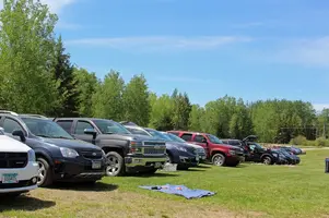 Line of vehicles down driveway.JPG