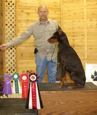 Matt and Zastava with total dog ribbon cropped  Sept 12 26.webp